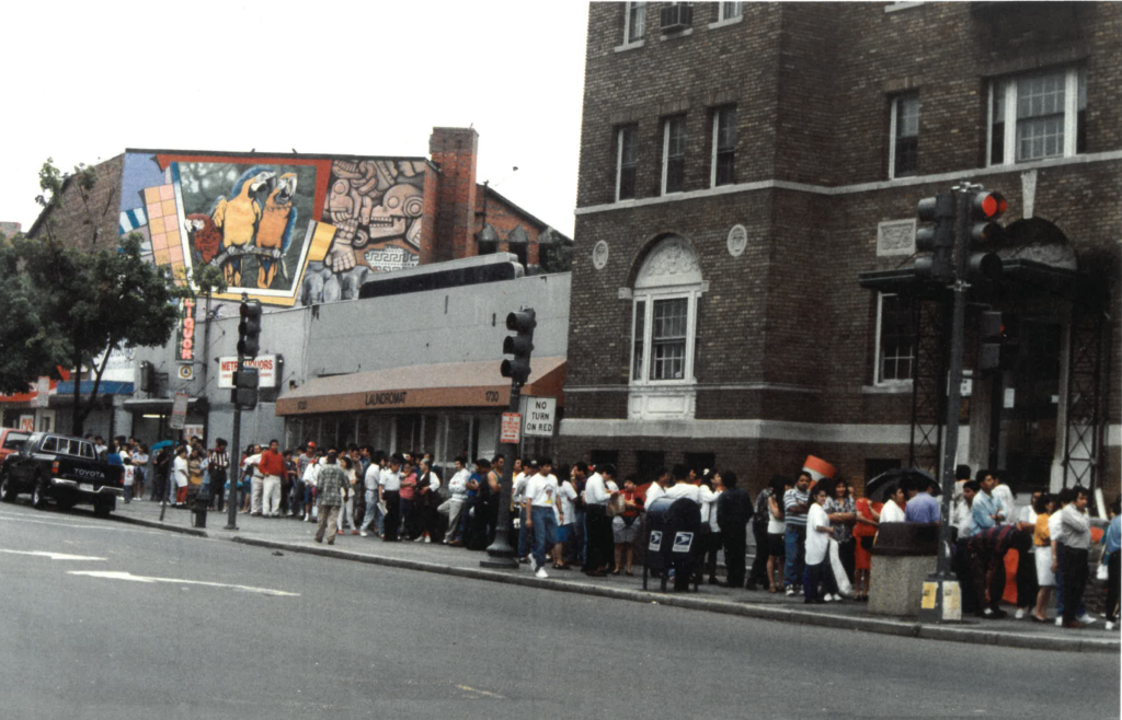 Columbia rd, NW, line of immigrants outside former Ayuda